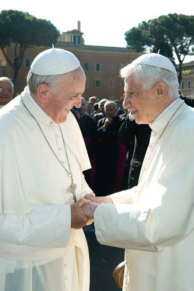 Popes clasp hands – The World is Quiet Here